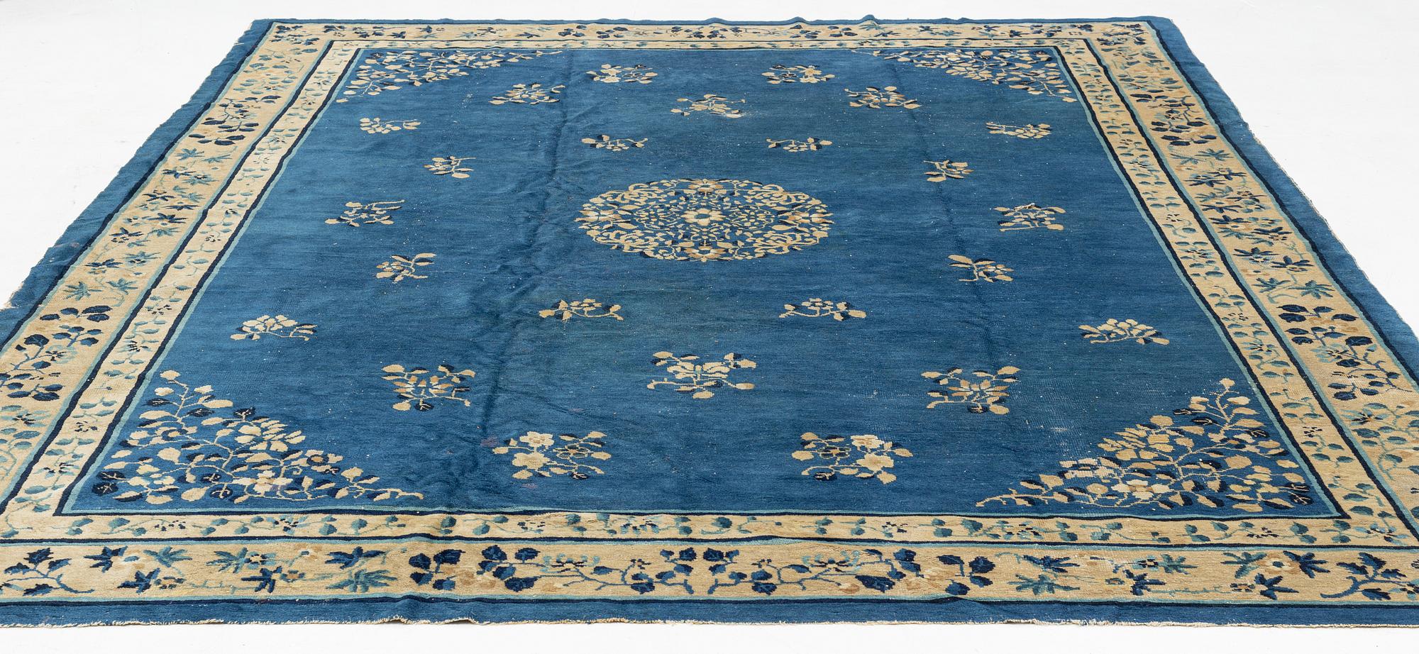 An antique Chinese carpet, c. 355 x 270 cm.