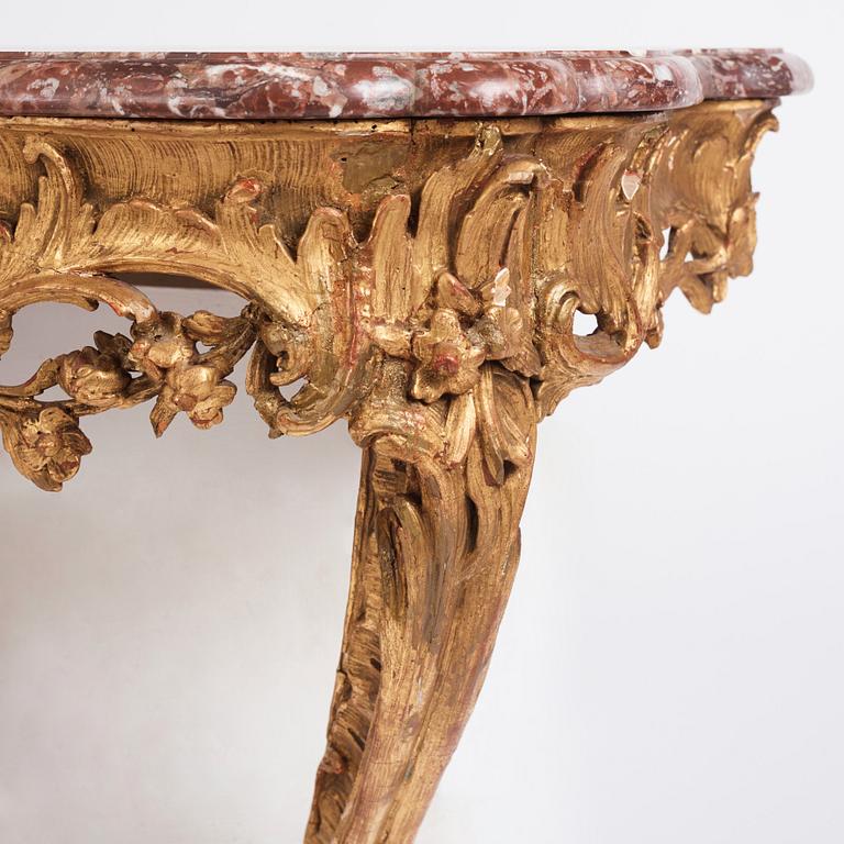 A Central European Louis XV carved and giltwood console table, mid 18th century.