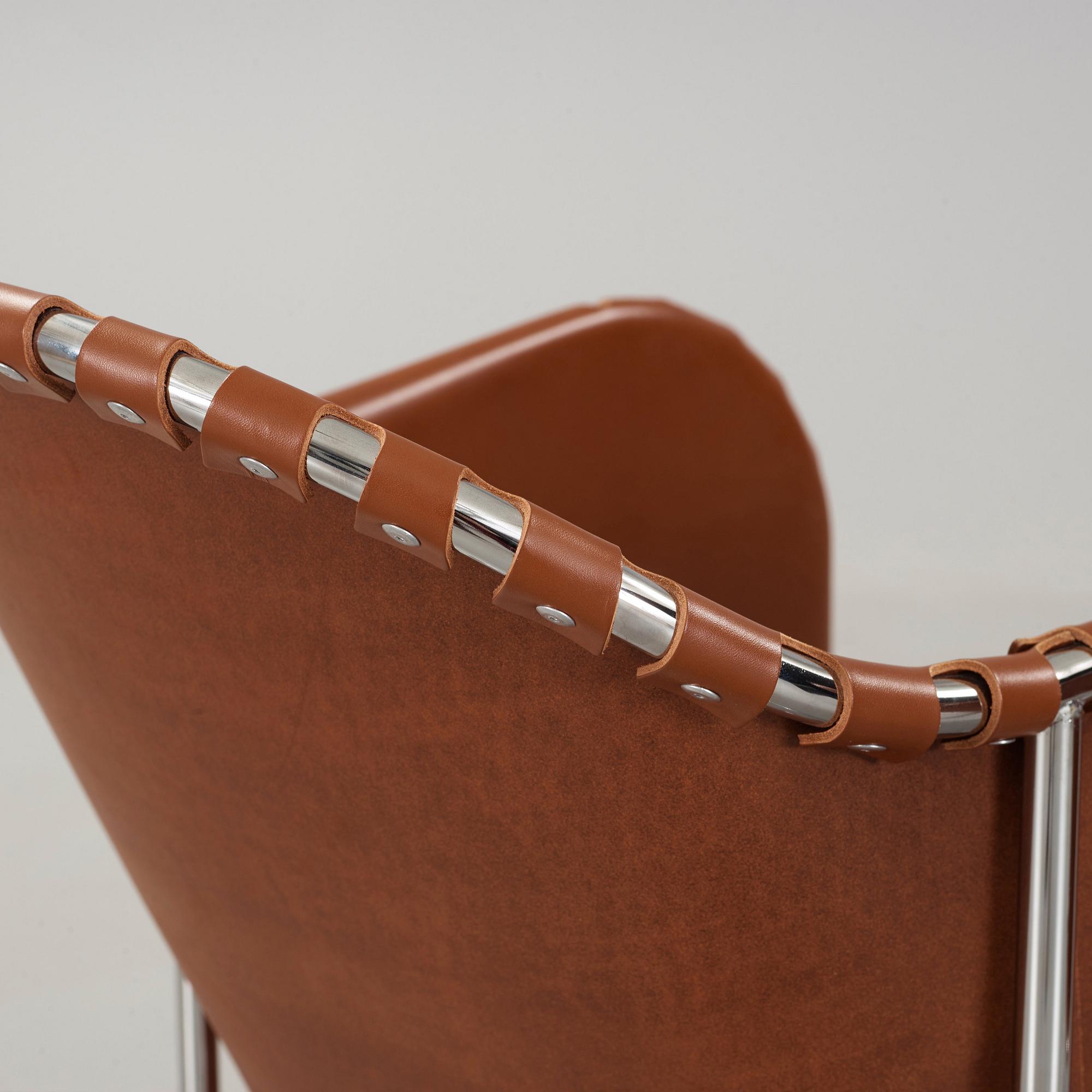 Mats Theselius, A pair of 'Bruno' brown leather and steel easy chairs, Källemo, Sweden.