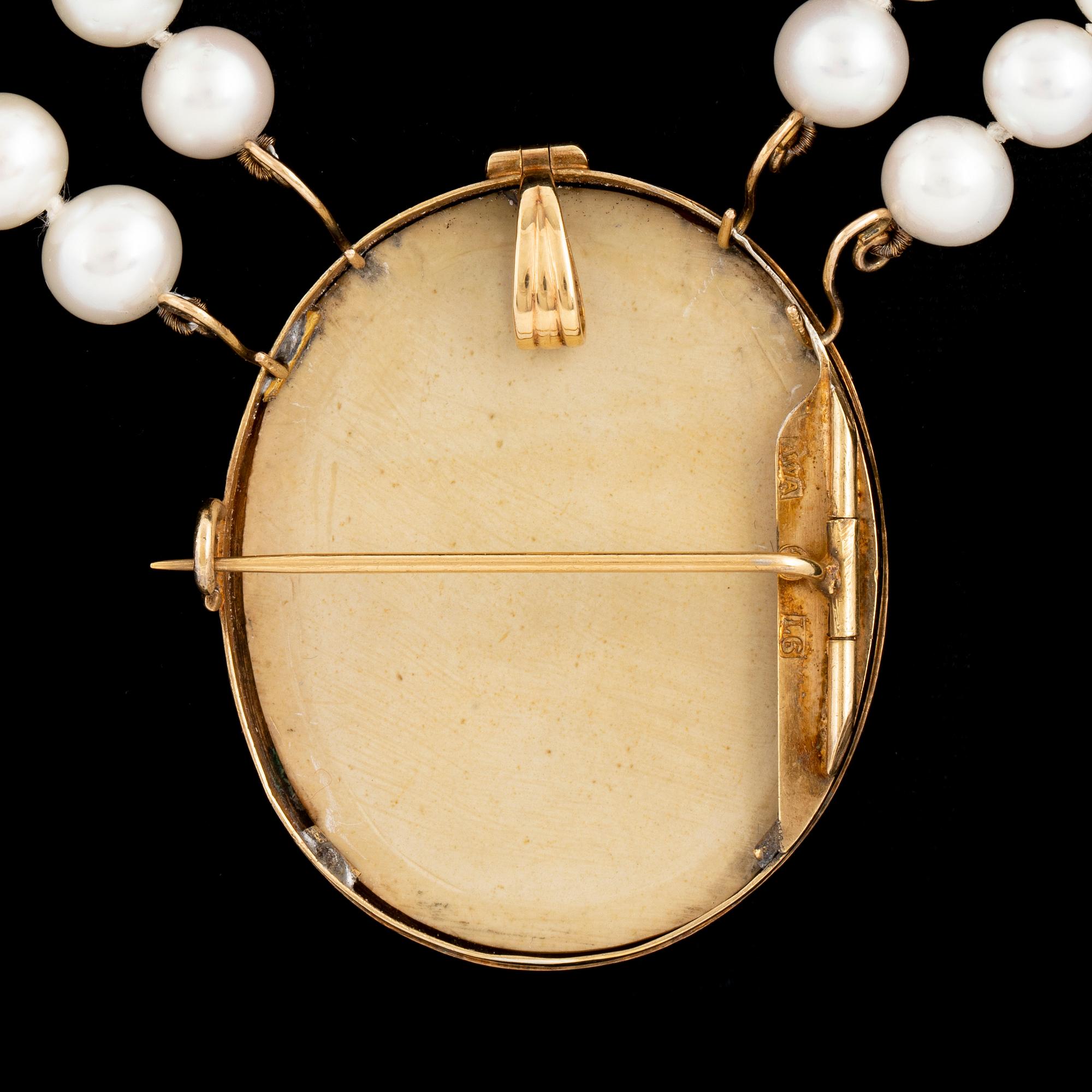 Lava cameo and cultured pearl necklace.