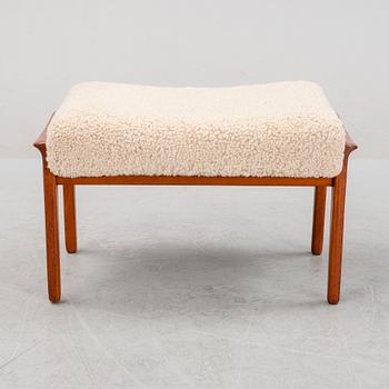 A Danish mid 20th Century sheepskin upholstered ottoman.