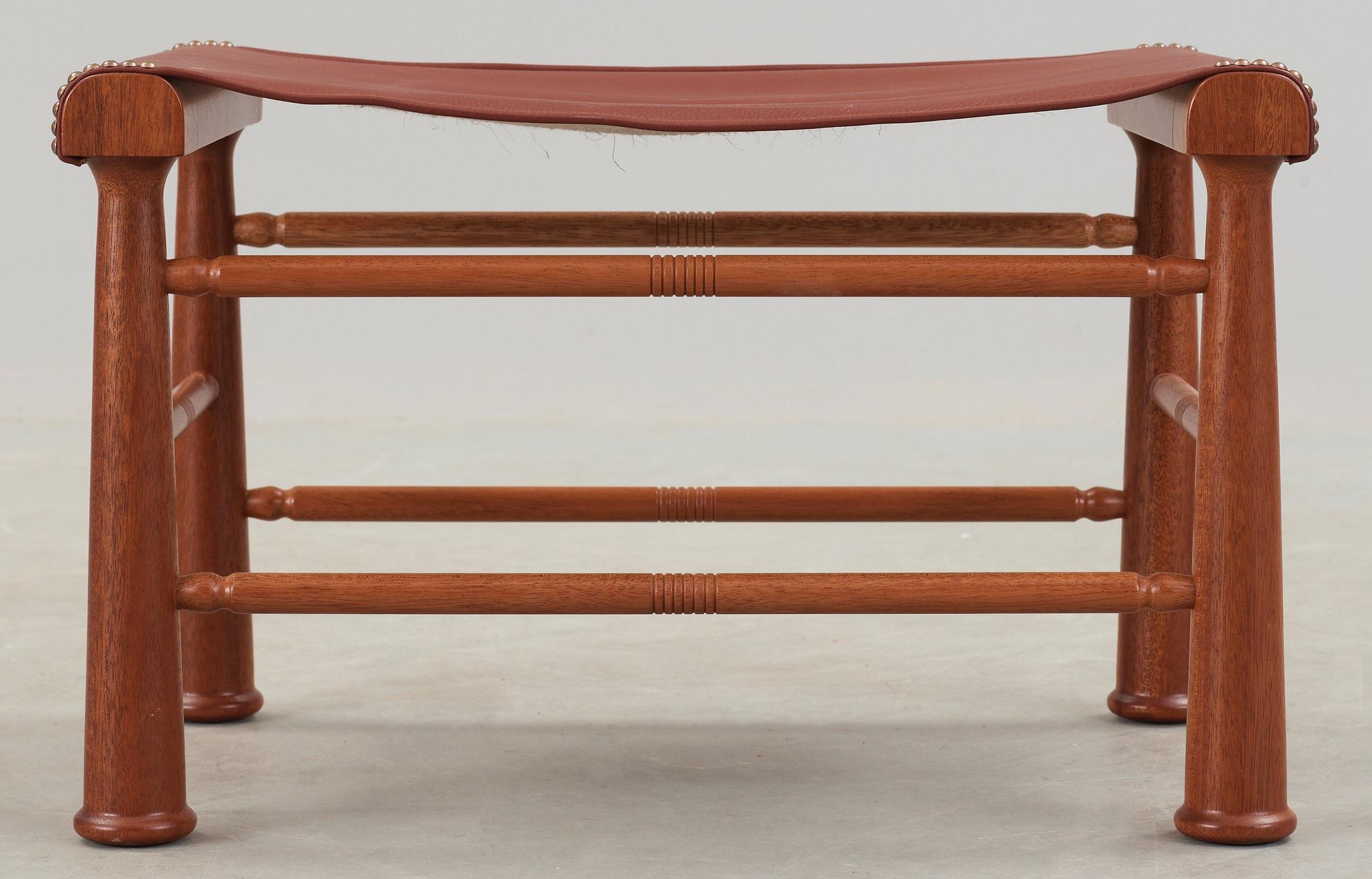 A Josef Frank mahogany and brown leather stool, Svenskt Tenn, model 972.