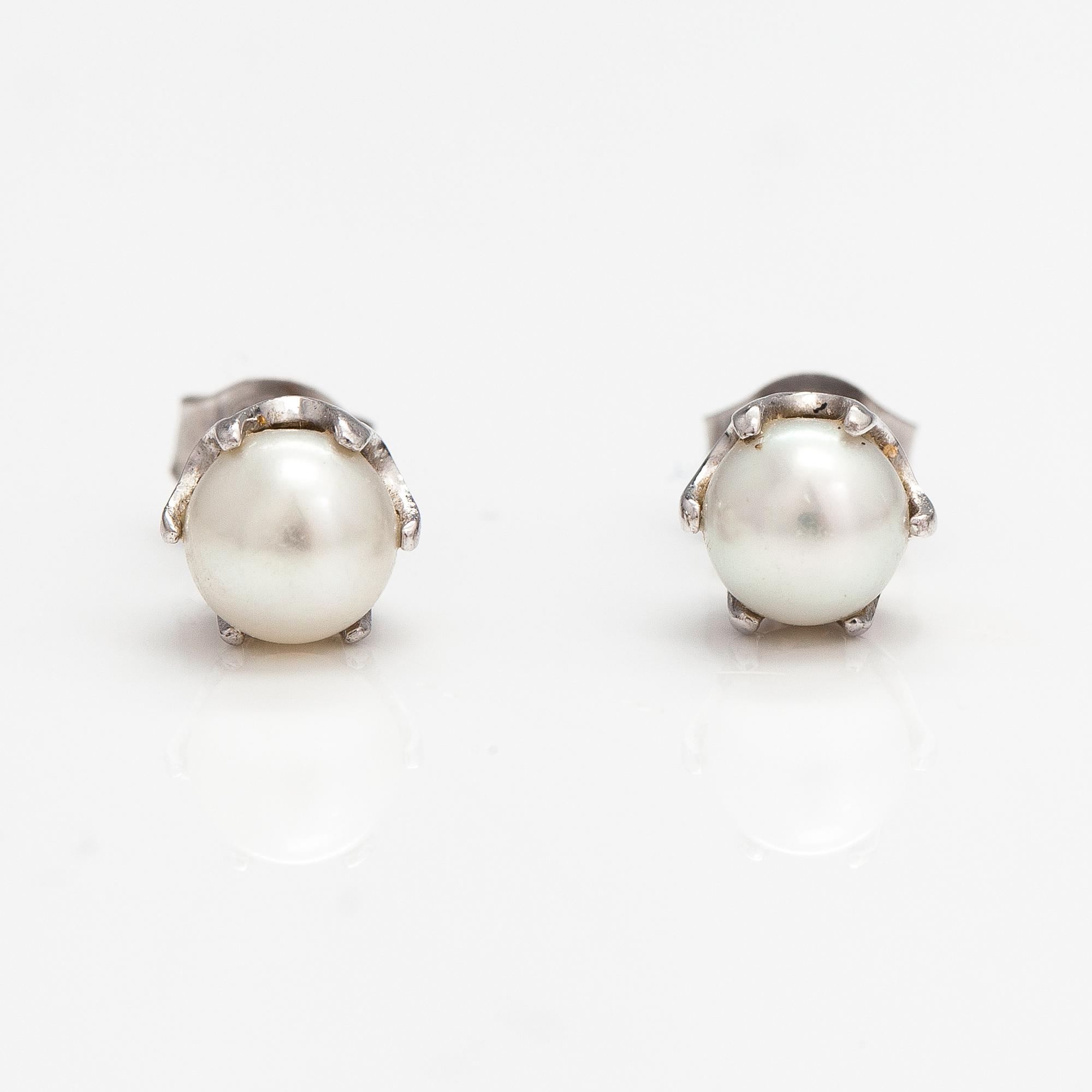 A pair of 14K white gold earrings with cultured pearls.