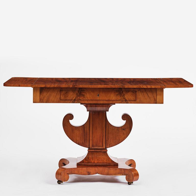 A Swedish Empire mahogany center table.