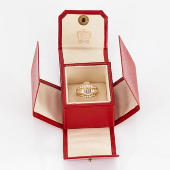 A RING set with an emerald-cut diamond.