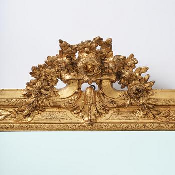 A Gustavian giltwood frame with mirror glass, late 18th century.