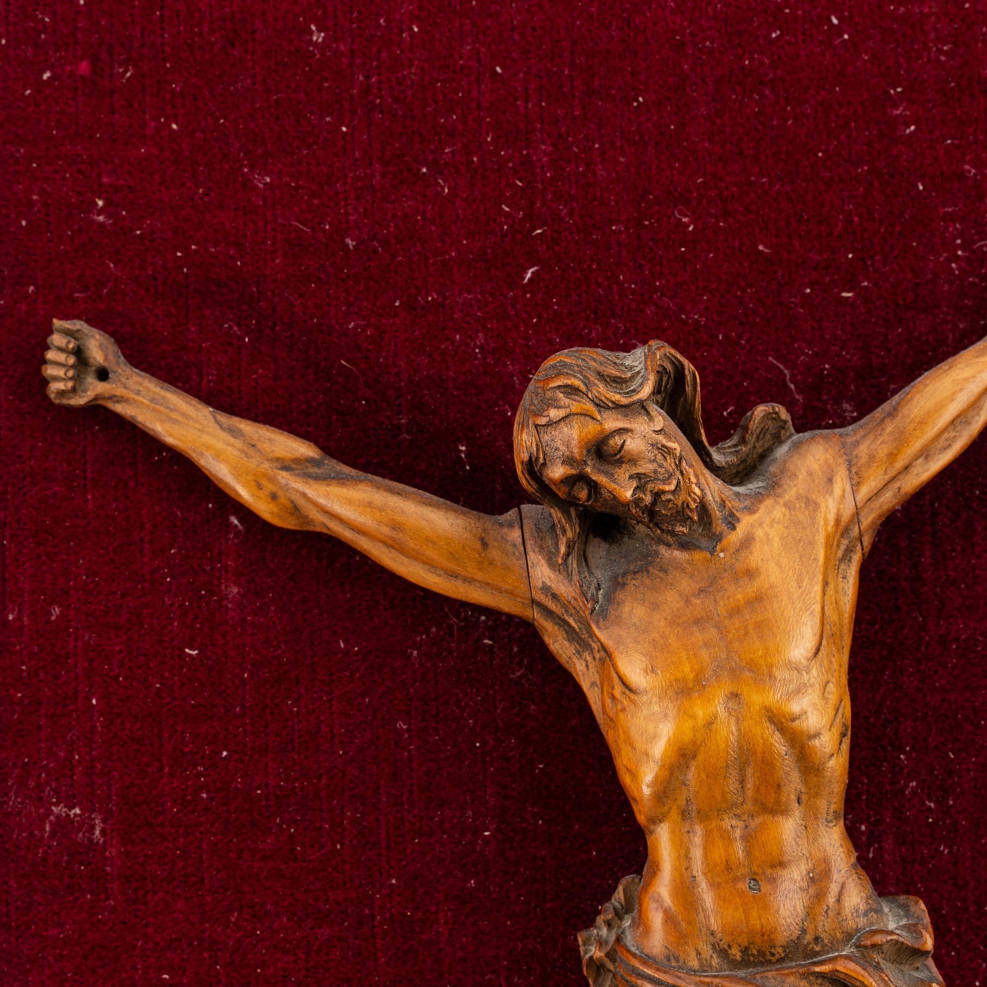 A carved wood crucifix, 17th/18th century.