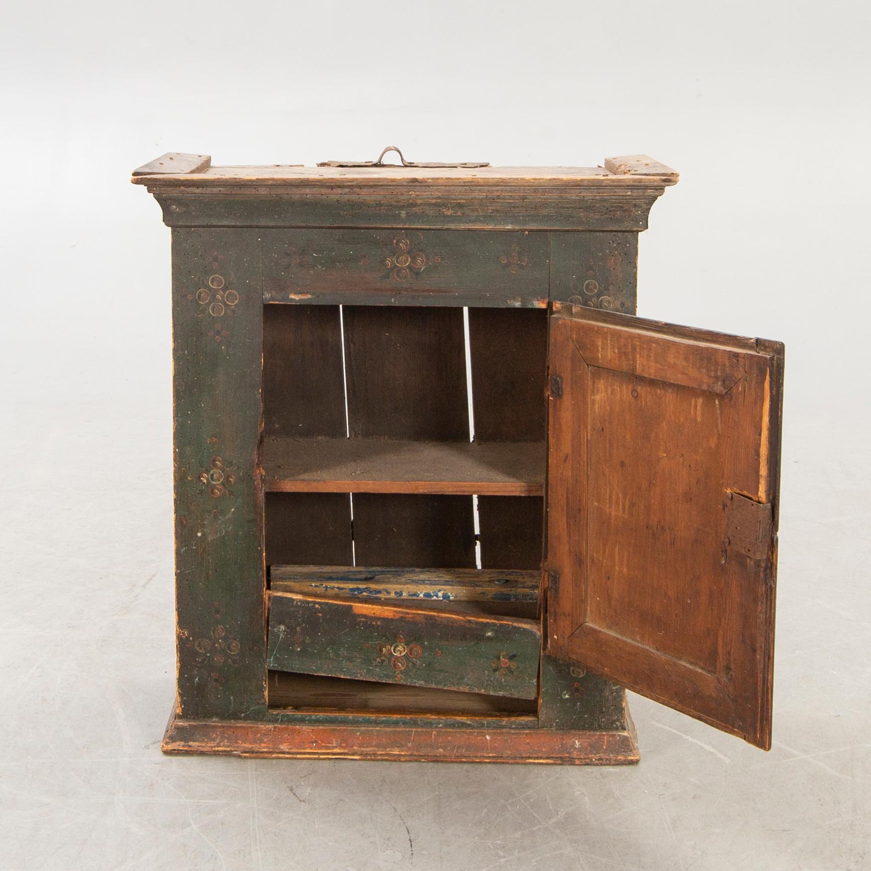 A Swedish painted wall cabinet around 1800.