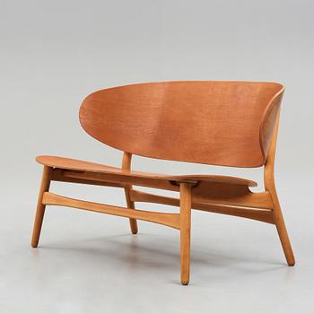 A HANS J WEGNER, a  "Shell set/ Skalsæt" comprising a sofa, a chair and a table, Fritz Hansen, Denmark 1950's.