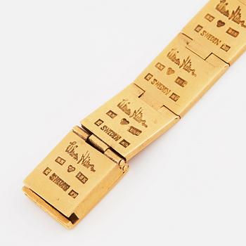 Wiwen Nilsson, an 18K gold bracelet executed in Lund 1955 with an Universal wrist watch.