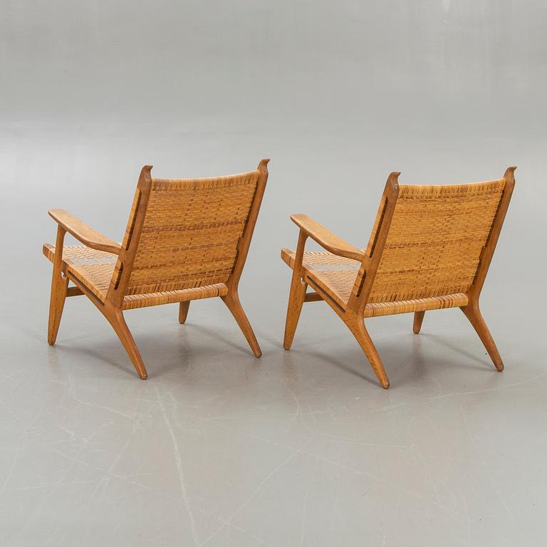Hans J Wegner, a set of two CH27 oak and rattan armchairs.
