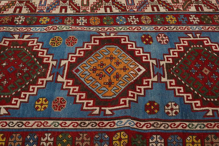 A RUG, a semi-antique Gendje probably, ca 209 x 124 cm.