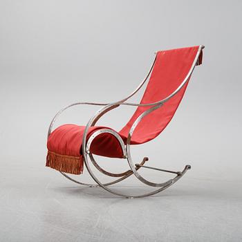 A 20th Century iron rocking chair.