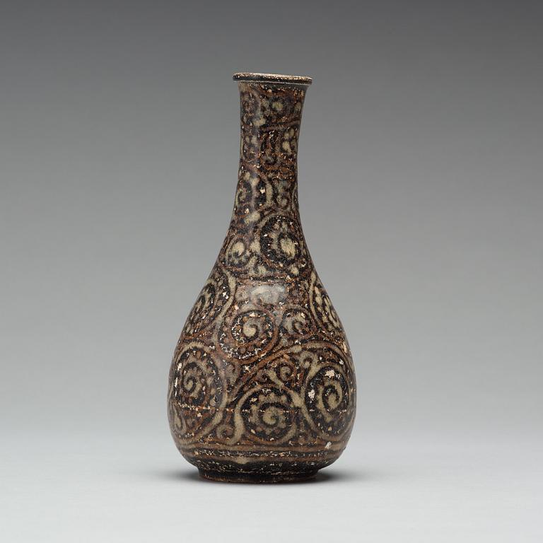 A black glazed sgrafitto vase, presumably Song dynasty (960-1279).