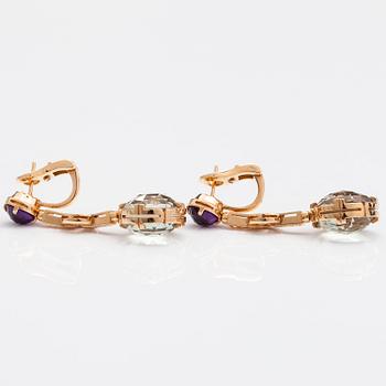 BULGARI, A pair of 18K gold earrings "Parentesi" with green quartzes, amethysts and ca 0.30 ct of brilliant cut diamonds.