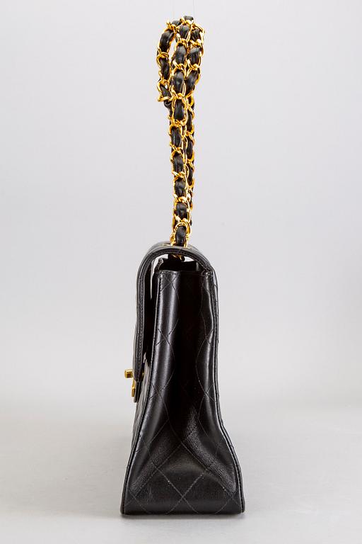 A Chanel maxi jumbo leather bag.