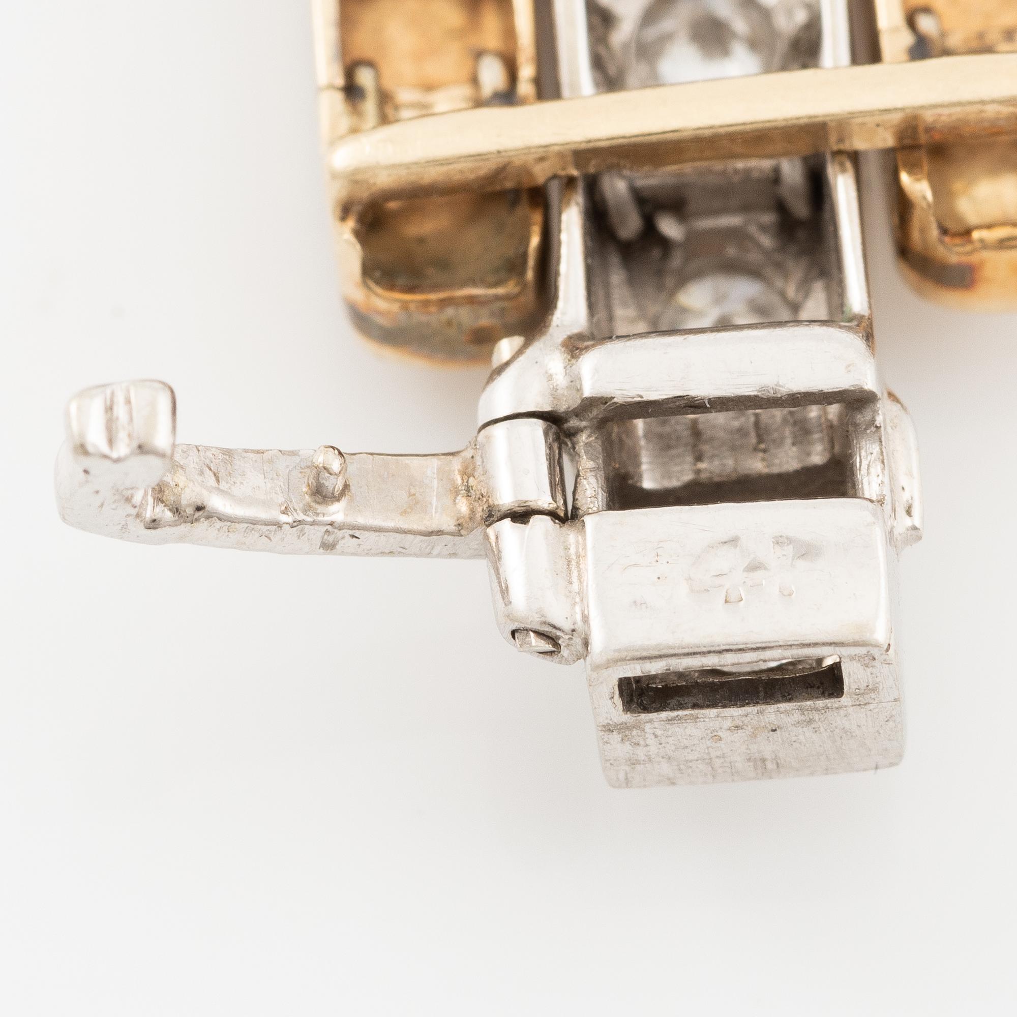 Bracelet in 14K gold and white gold with brilliant-cut diamonds.