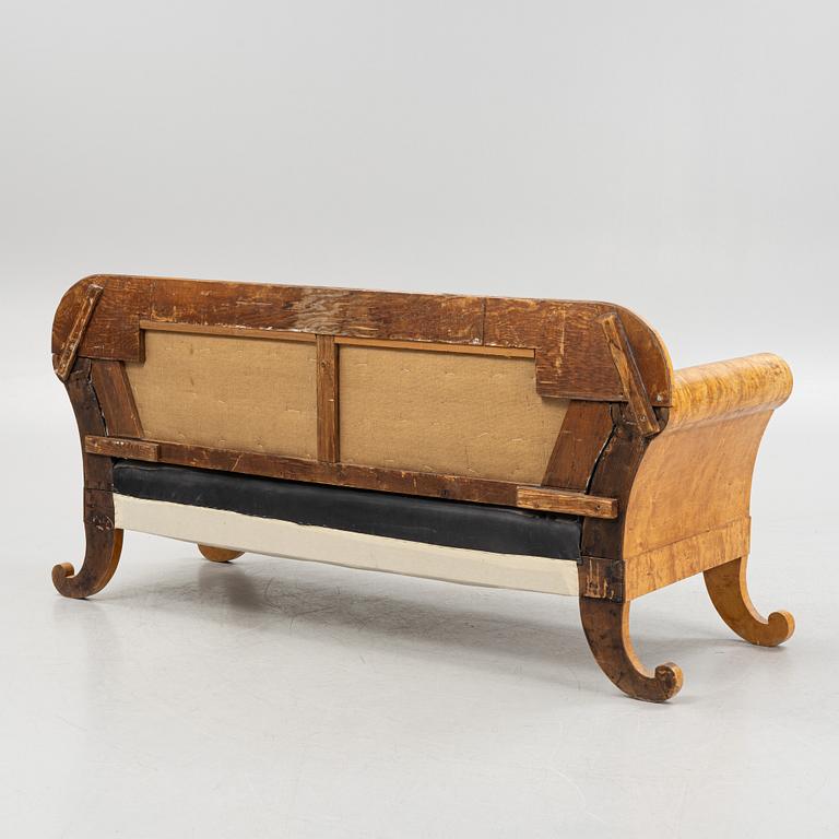 An Empire sofa, first half of the 19th century.