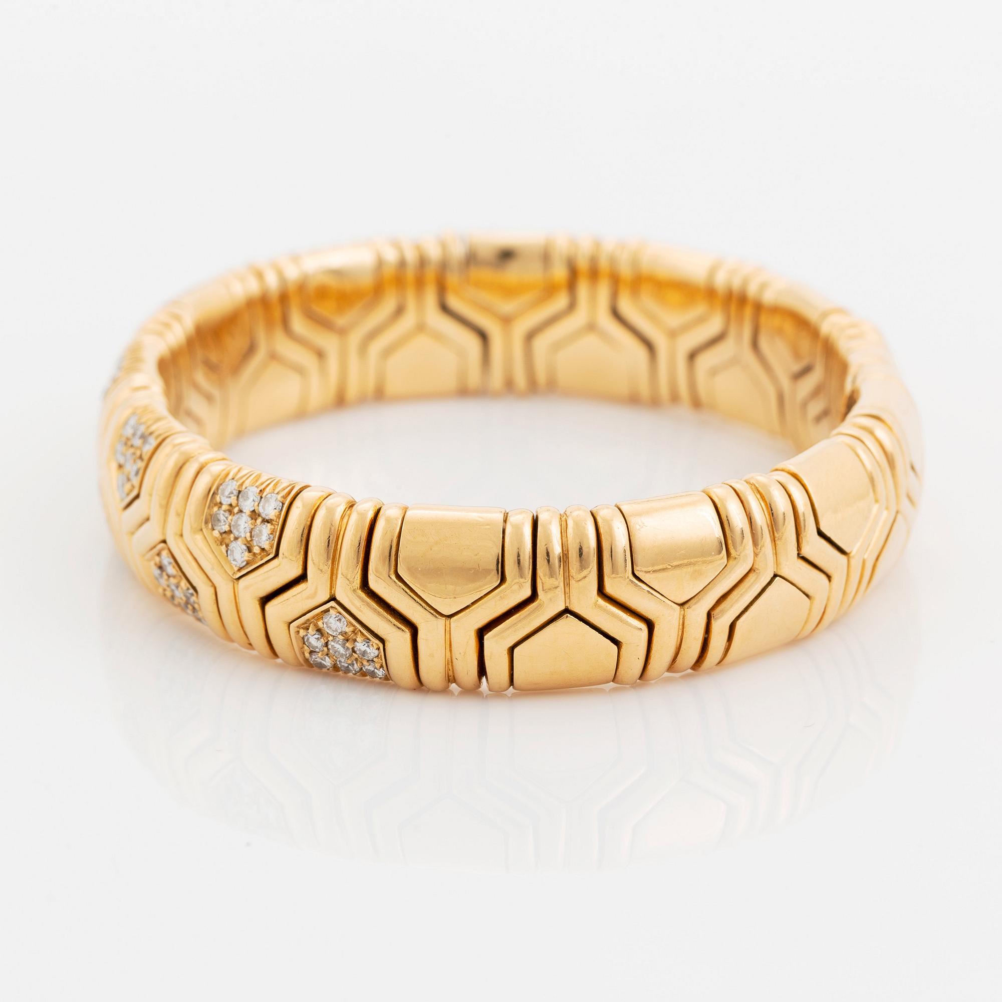 An 18K gold Bulgari bracelet set with round brilliant-cut diamonds.