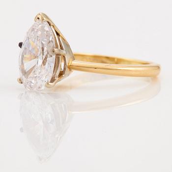 A pear cut diamond ring.