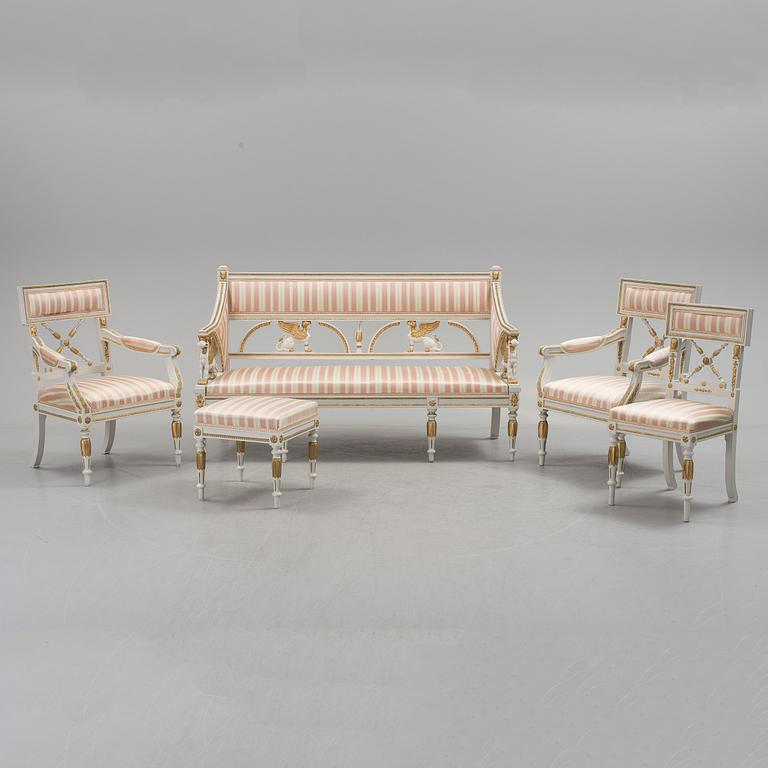 A set of two armchairs, a sofa, a stool and a chair. Early 20th century.