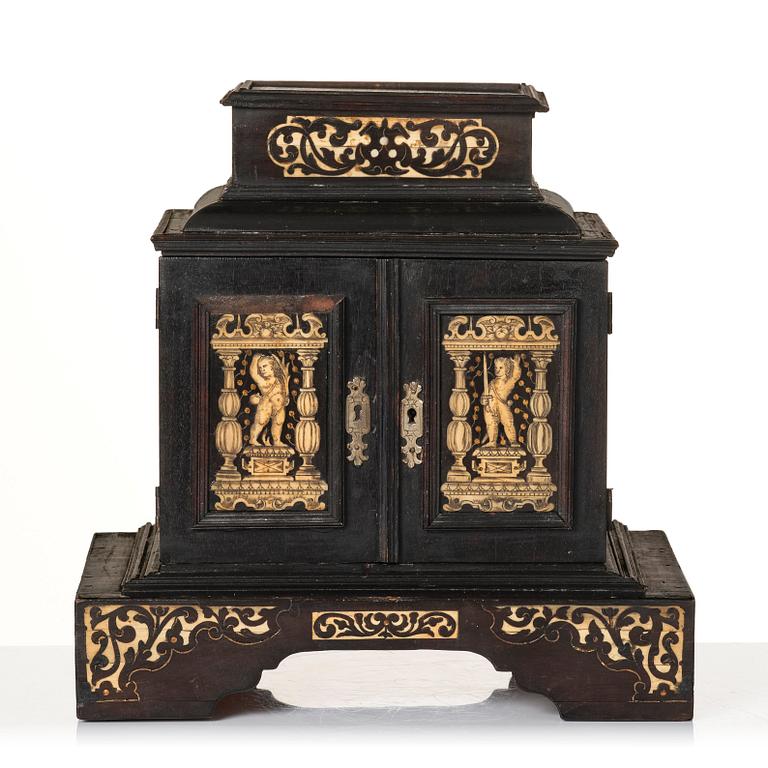 A South German, presumably Augsburg, ebony, ebonised and engraved bone inlaid table cabinet,  17th century.