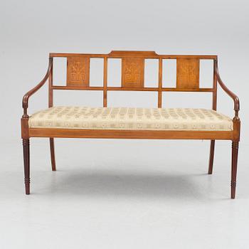 A 1920/30s Swedish Grace sofa, a pair of chairs, a pair of armchairs and a table veneered with mahogany.