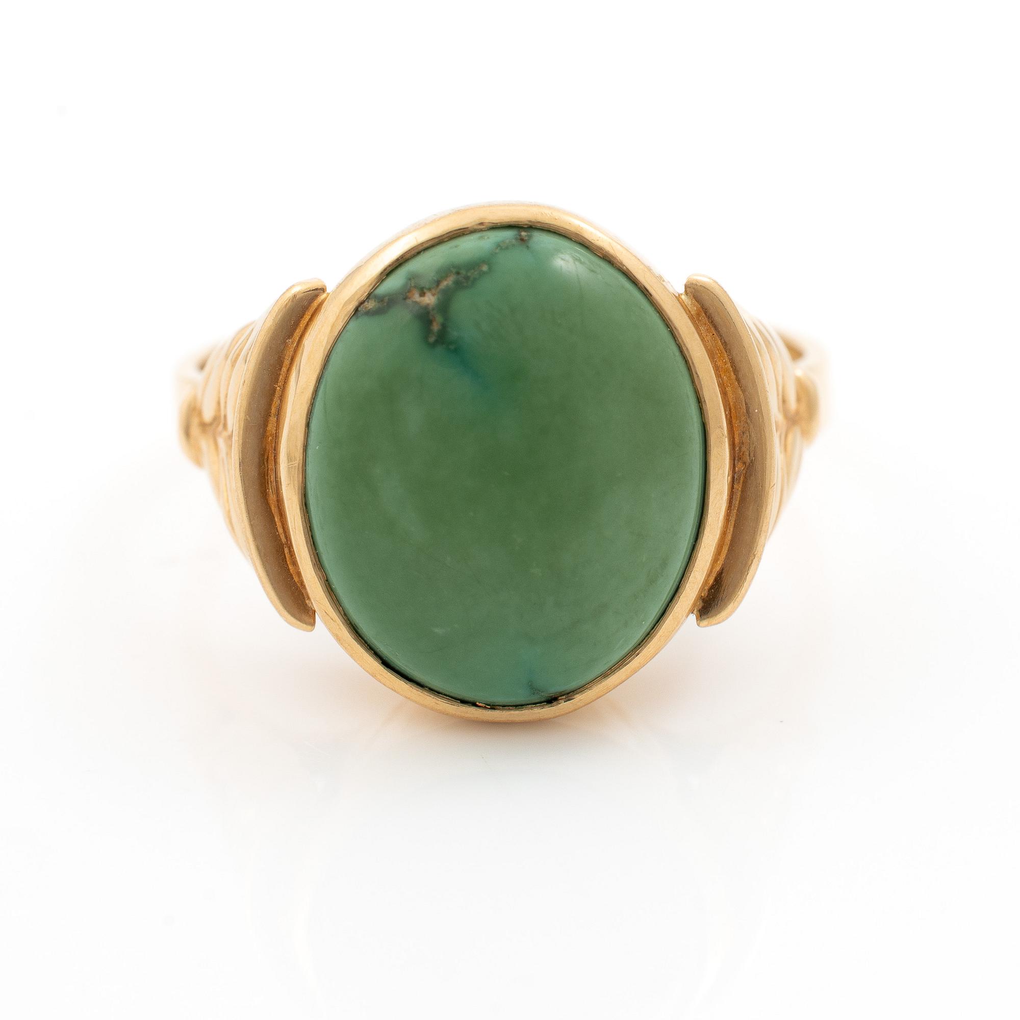 18K gold ring with green stone.