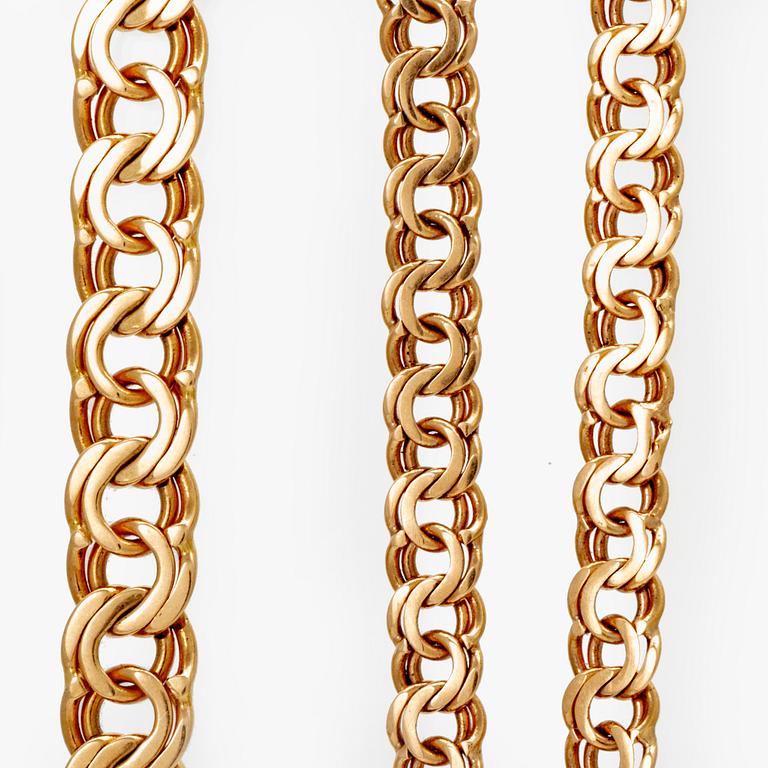 Two 18K gold bracelets.