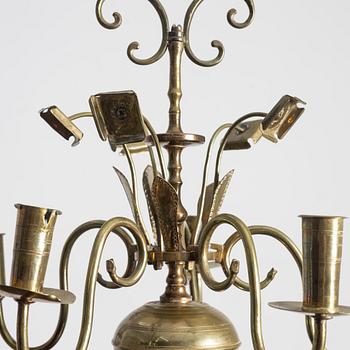 A Swedish five-branch brass chandelier, circa 1800.