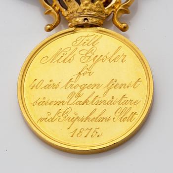 A Swedish Royal gold medal and a gilt silver decoration.