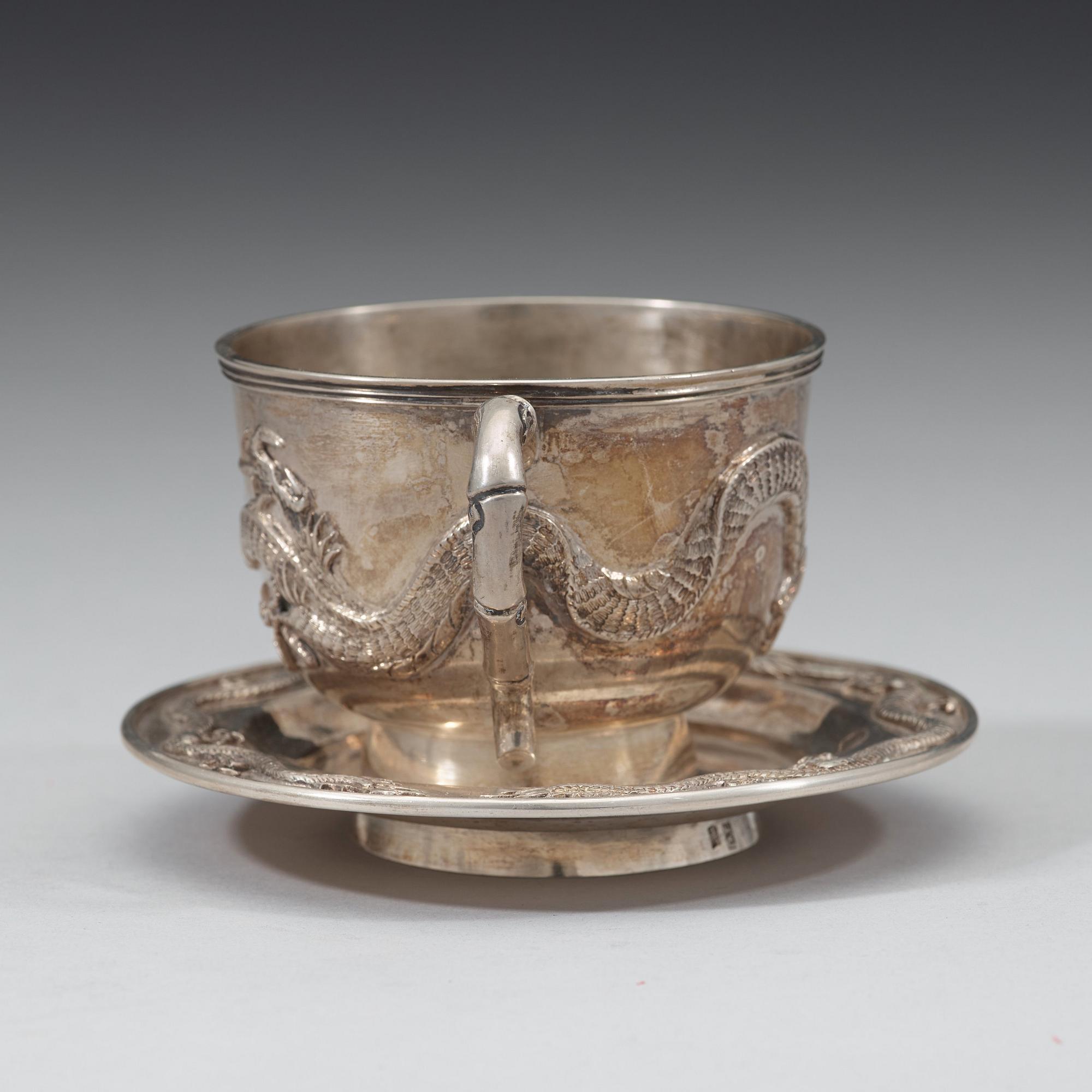 An export silver cup and saucer, probably Shanghai, early 20th century.