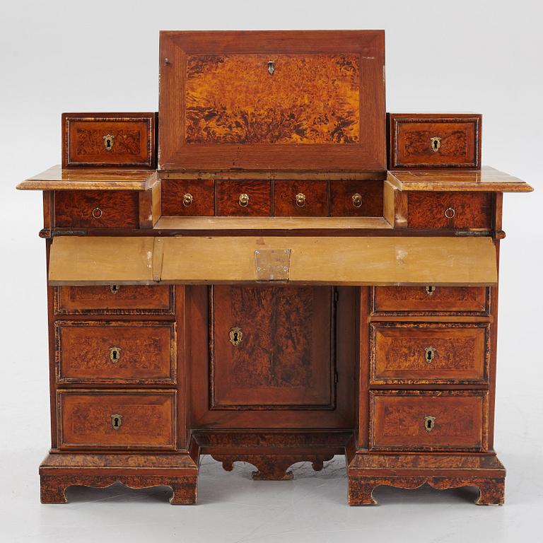 A Swedish late Baroque alder-veneered 'knee-hole' writing desk, first part of the 18th century.