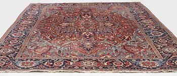 An Antique Heriz carpet, North west persia, c. 380 x 310 cm.