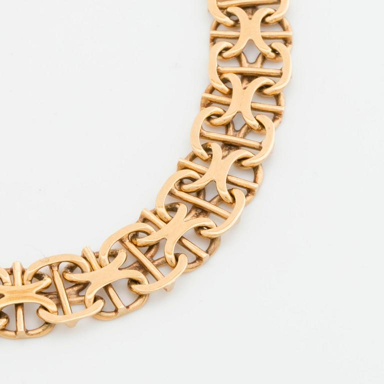 ARMBAND 18K guld x-länk med stav, Stockholm 1968.