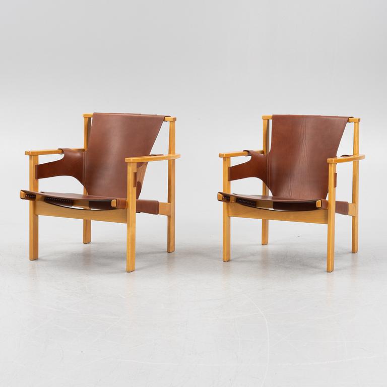 Carl-Axel Acking, a pair of oak and brown natural leather 'Trienna' chair, Nordiska Kompaniet, Sweden.