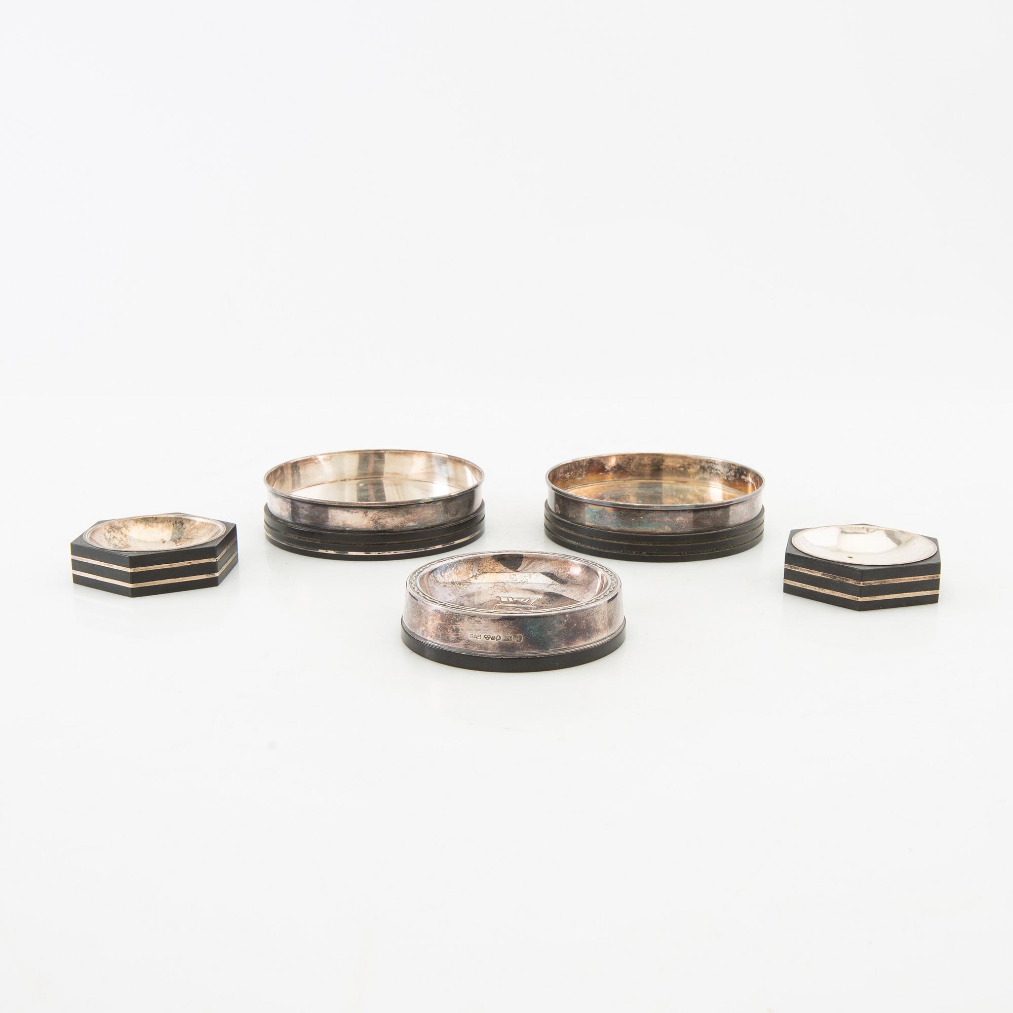 Salt cellars 1 pair and bottle coasters 3 pcs GAB Stockholm 1937, 1938 and 1955 silver and bakelite.