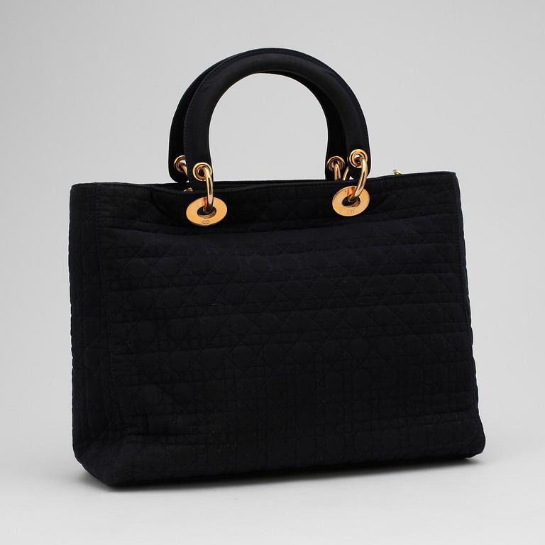 CHRSITIAN DIOR, a dark blue handbag.