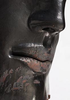 Hertha Hillfon, a black glazed stoneware wall sculpture in two parts of a face and a sky, executed in her own studio, Stockholm 1960s.