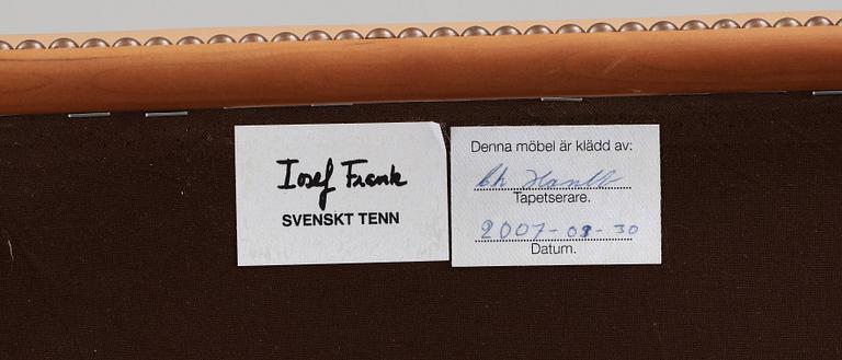 A Josef Frank cherry and beige leather armchair, Svenskt Tenn 2007, model 652.