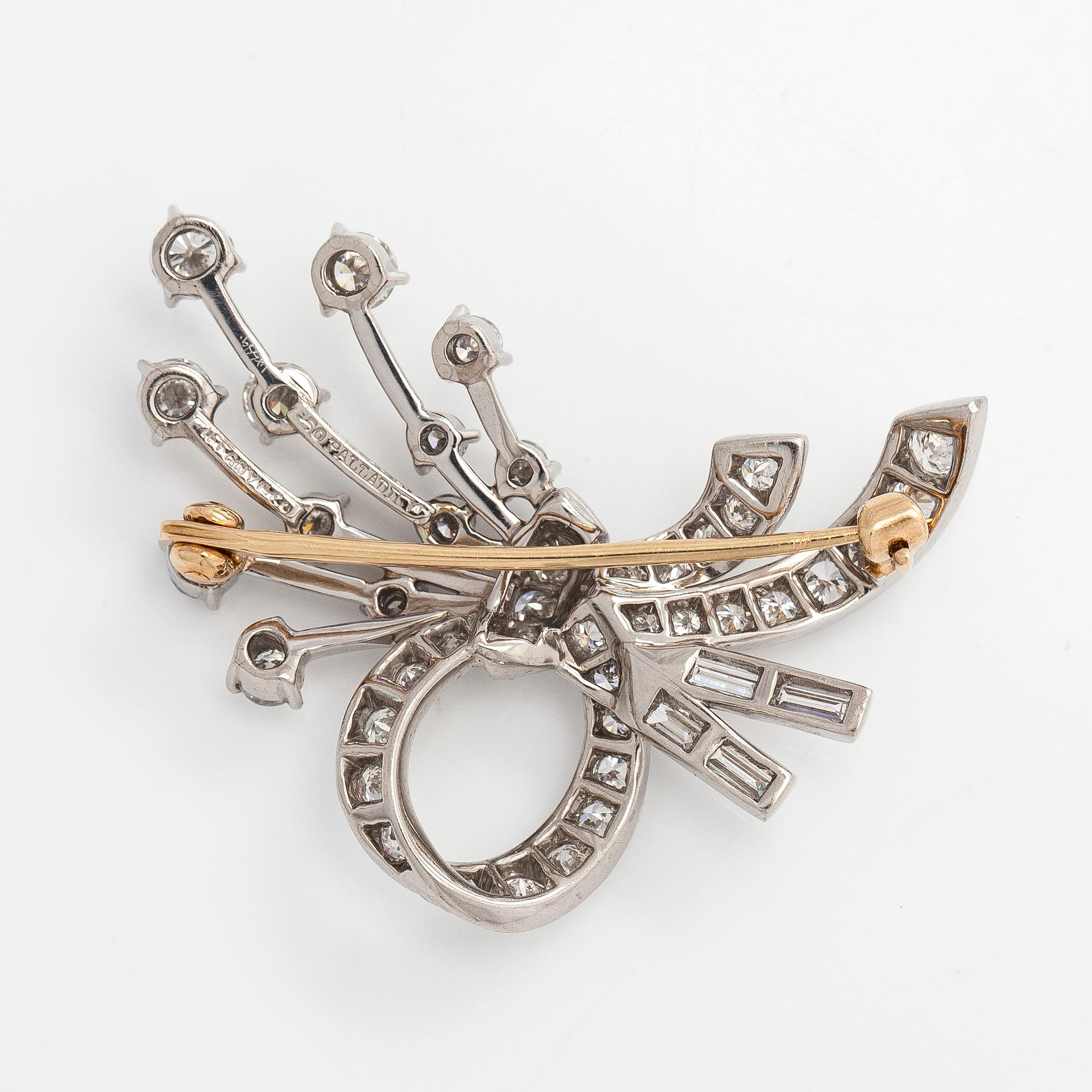 Tiffany & Co, A palladium brooch with brilliant- and baguette cut diamonds.