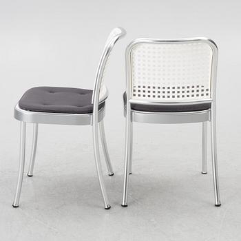 Vico Magistretti, a "Shine" dining table with twelve chairs, De Padova, Italy, around the year 2000.