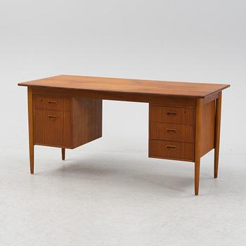 A teak veneered desk, 1950's/1960's.