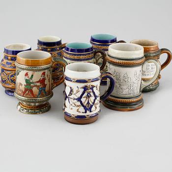 A set of eight majolica mugs from Rörstrand, around the turn of the century 1900.