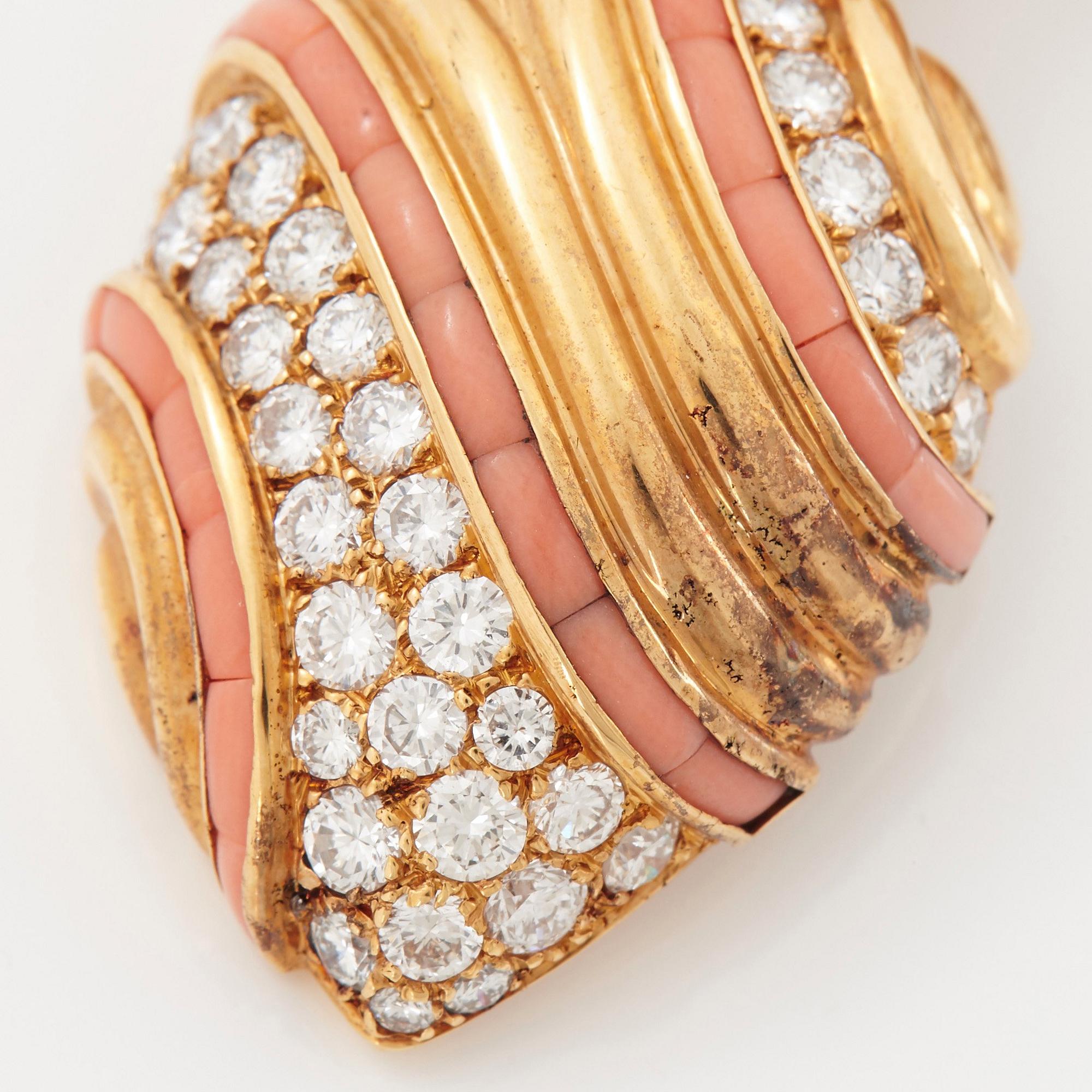 A pair of 18K gold Boucheron earrings set with round brilliant-cut diamonds and coral.