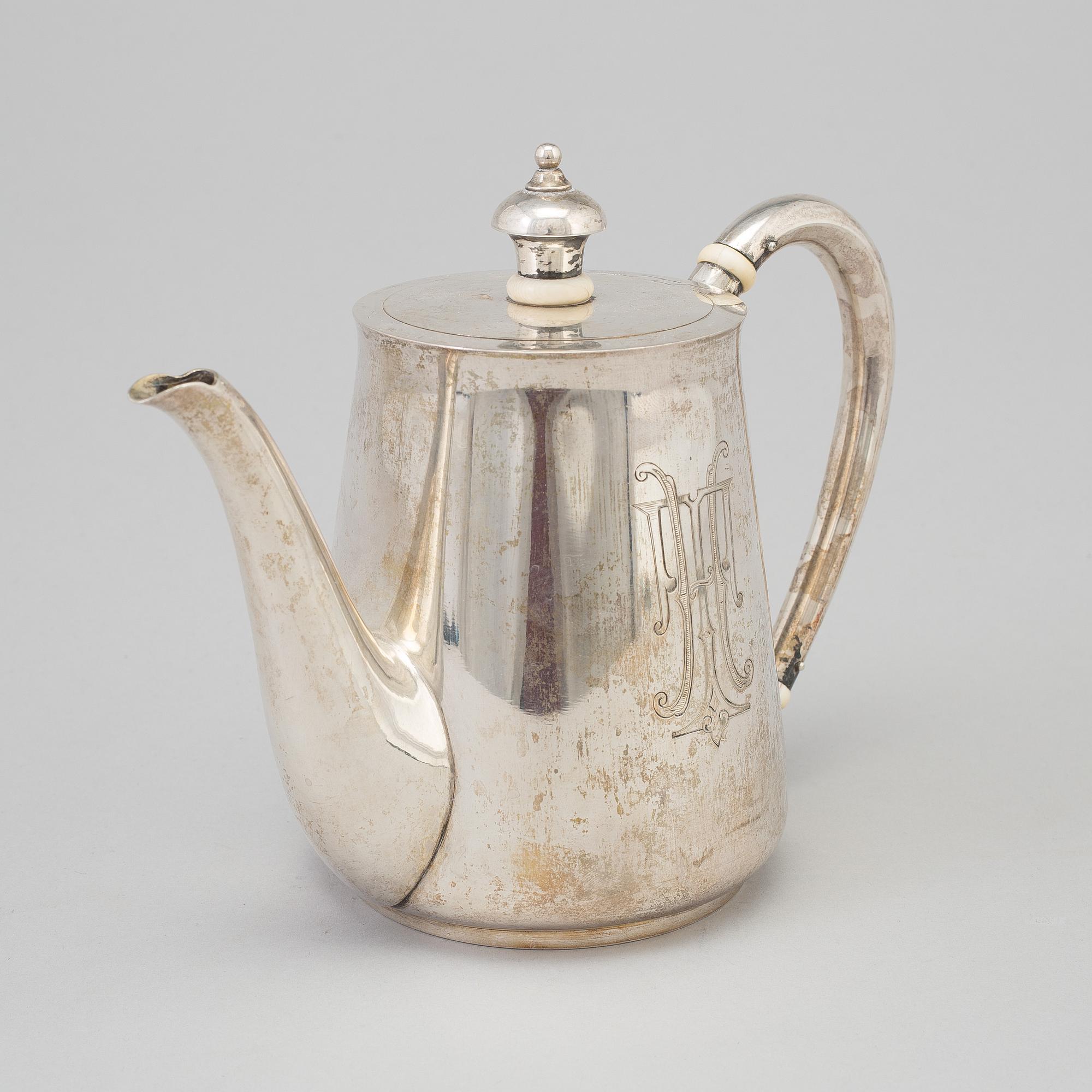 A Russian parcel-gilt teapot, mark of Nicols Karl & Plinke, St Petersburg, 1880/90s.