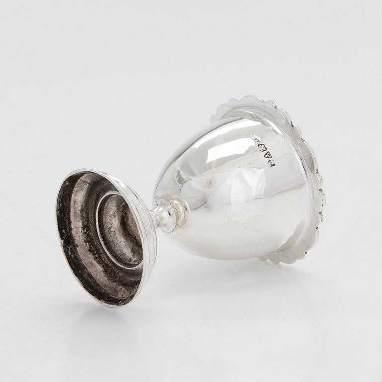 A sterling silver egg cup and napkin ring in original fitted case, Chester 1909.