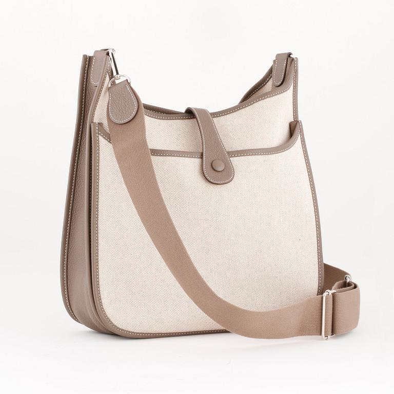 HERMÈS, a canvas and grey leather crossbody bag, "Evelyn".