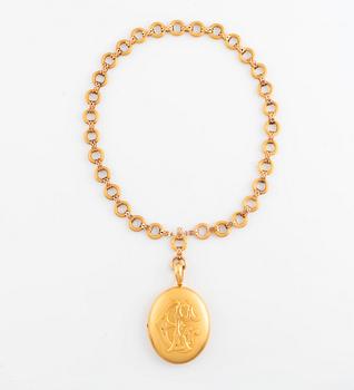 A gold locket with chain.