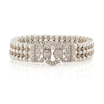 519. An 18K white gold bracelet set with cultured pearls and round brilliant-cut diamonds.